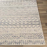 Close-up of the Westborough Beige Area Rug showing its contemporary blue and cream geometric pattern and soft texture. Front