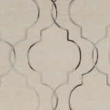 Close-up of the Wycombe Area Rug. Hand-woven wool rug with a black and light gray geometric pattern on a taupe background. Swatch