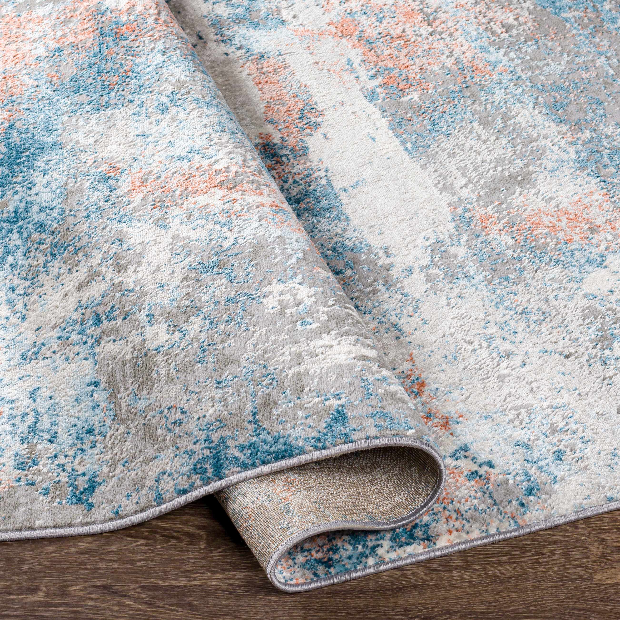 Folded section of Yakutiye  Area Rug - Clearance, displaying material thickness and weave. Contemporary Area Rug Backing  