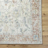 Close up of the Yetta Beige Thick Luxe Area Rug showing its traditional floral pattern and soft, neutral colors. Corner
