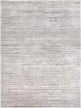Close-up of the Yemassee Tibetan Striped Area Rug. Charcoal, ivory, medium gray, and tan stripes create a textured, modern look. Design-Rectangle-710103