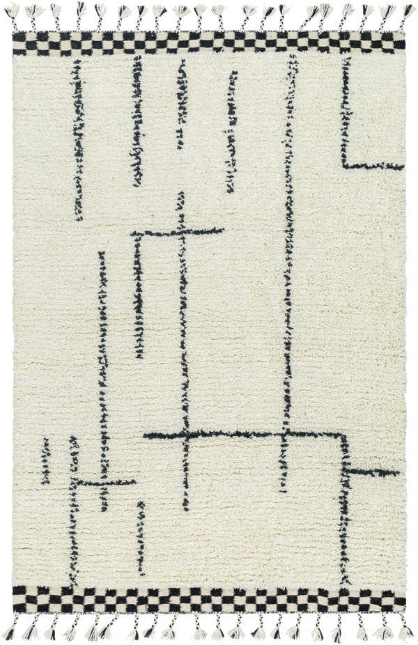 Yukia Area Rug close-up. Hand-woven wool rug in ash and light silver with a geometric pattern and tassels. Design-Rectangle-576