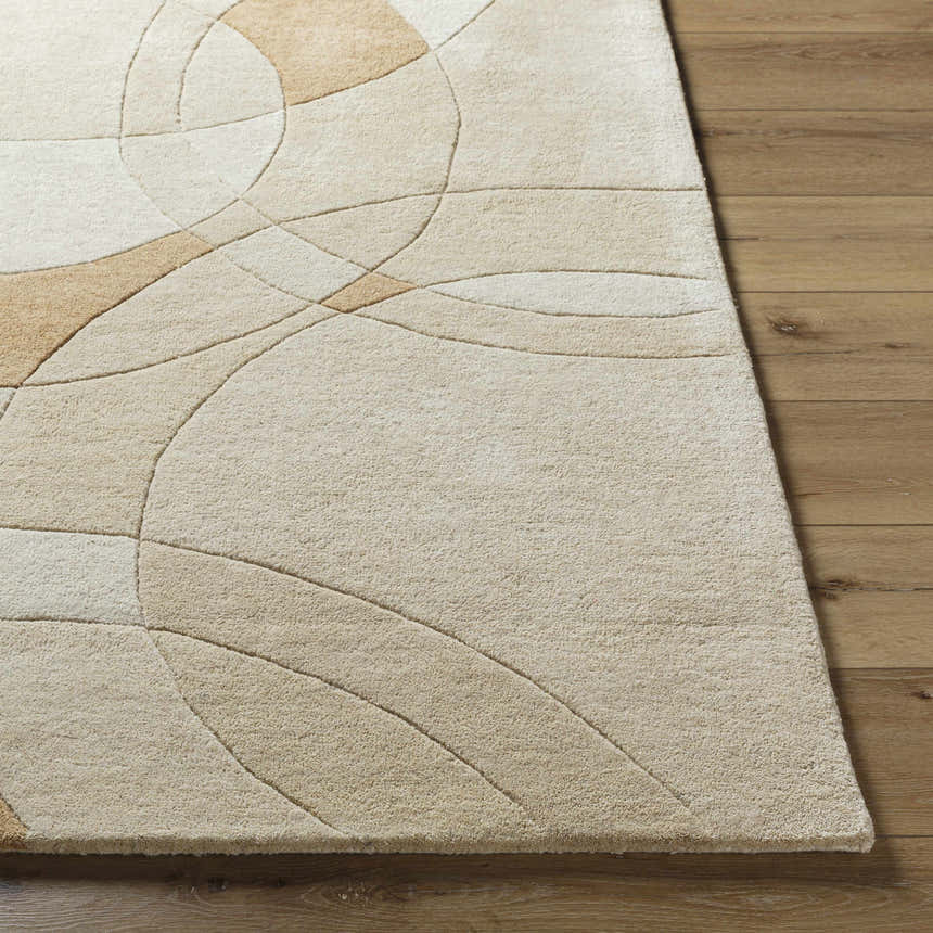 Close-up of the hand-tufted Yaxha Modern Wool Rug. Camel, tan, and warm gray tones with an abstract geometric design. Front
