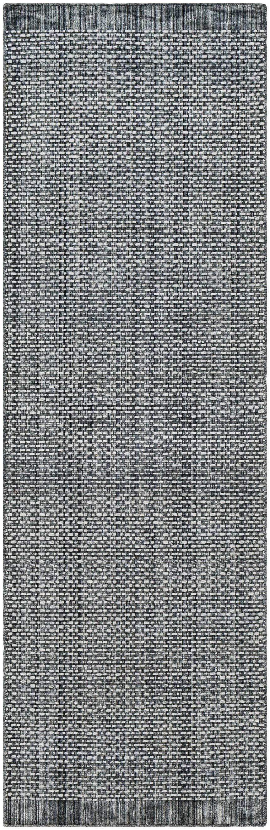 Close-up of a hand loomed light gray area rug showing woven texture and subtle charcoal and cream color variations. Design-Runner-268