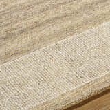 Close up of the hand-tufted Yosef Area Rug showing prairie dust, tan, and warm gray wool texture. Texture
