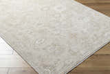 Close-up of the ash and light silver Yonca Luxe Rug, showcasing its traditional floral pattern and soft texture. Corner