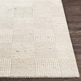 Close-up of the hand woven Yarrabilba Area Rug showing ivory color, texture, and contemporary design. Front