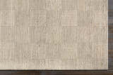 Close-up of the hand woven Yarrabilba Area Rug. Off white rug with a textured, contemporary design. Corner