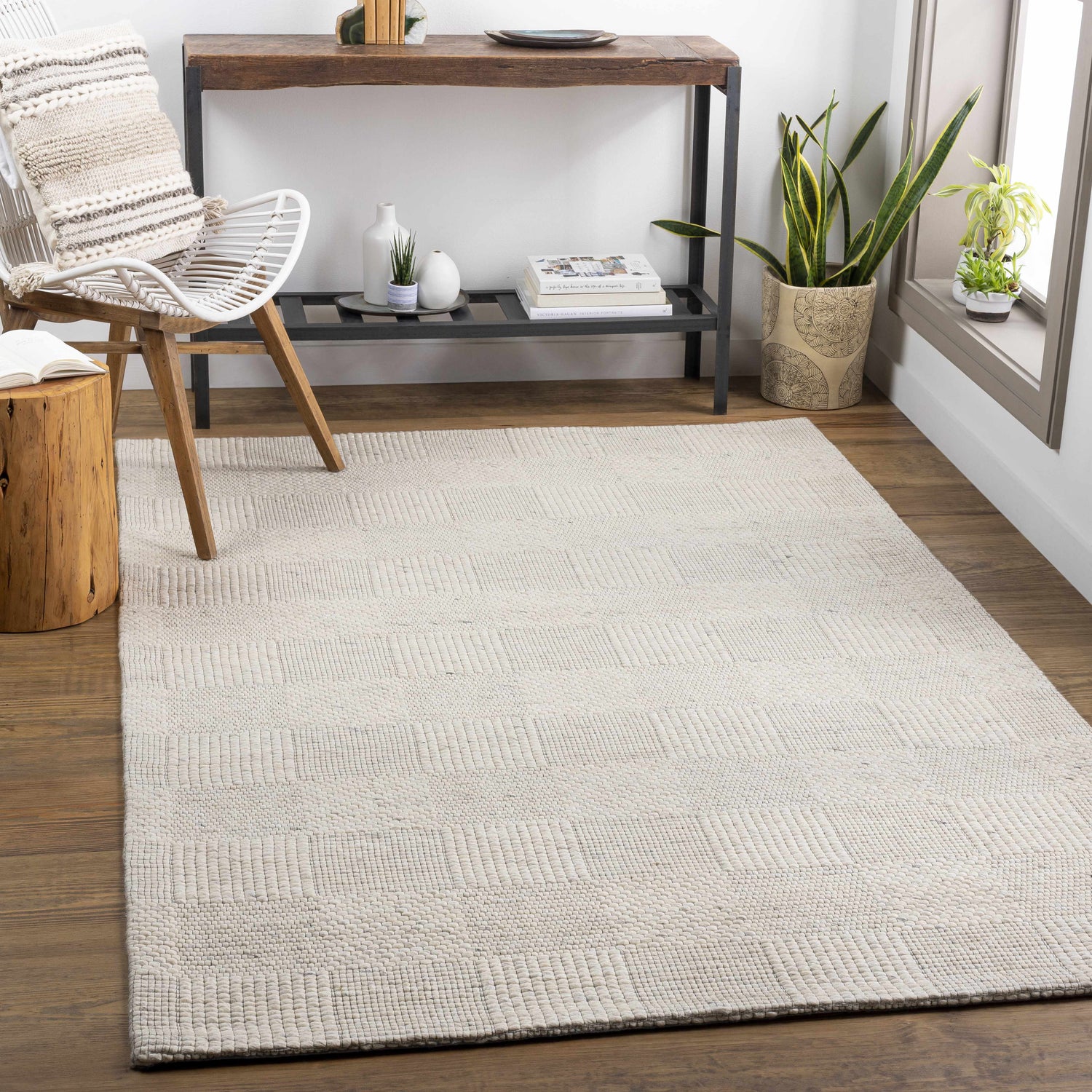 Living room scene with ivory Yarrabilba area rug, wood floors, chair, and console table. Roomscene-Rectangle