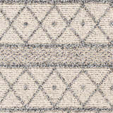 Close-up of Yuko Area Rug showing bone and dark gray diamond pattern and hand woven texture. Swatch