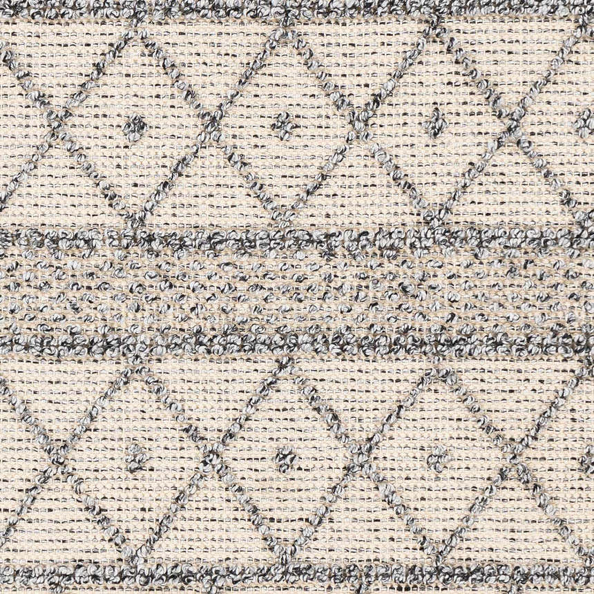 Close-up of Yuko Area Rug showing bone and dark gray diamond pattern and hand woven texture. Swatch