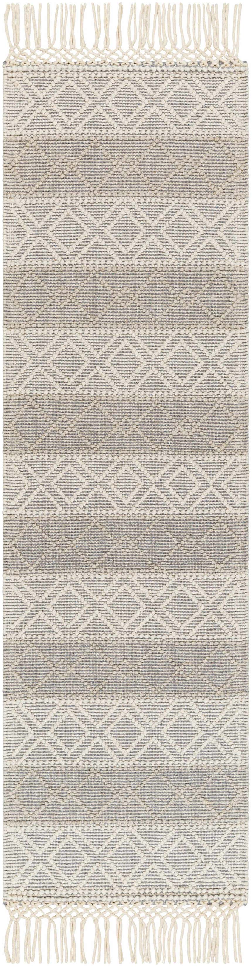 Close-up of the hand woven Zaza Wool Rug with Tassels in bone and cloud gray geometric pattern. Farmhouse style. Design-Runner-2376