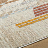 Close-up of the Zanna Area Rug, a contemporary design with burnt orange, dark red, gray, ice blue, and white colors. Texture