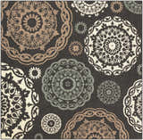 Zephyrhills Area Rug: Close-up of beige, black, brown, and sage floral medallions on a dark gray olefin rug. Design-Square-73