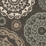 Close-up of Zephyrhills Area Rug showing beige, black, brown, dark red, and sage floral pattern and machine woven texture. Swatch