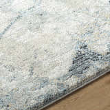 Close-up of the Urowo Light Gray Thick Luxe Rug showing its plush texture and abstract cream, blue, and gray pattern. Texture