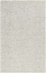Close-up of the hand-tufted Zayit Area Rug. Light silver wool with a subtle sterling gray abstract pattern. Design-Rectangle-58
